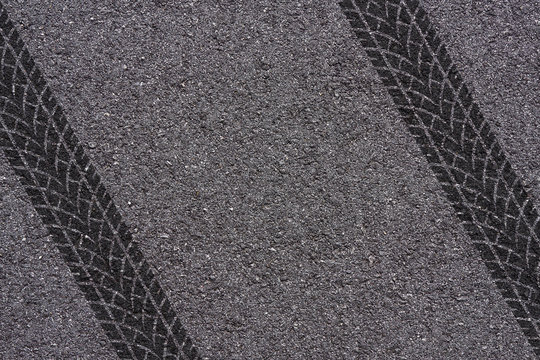 tire tread pattern on asphalt background