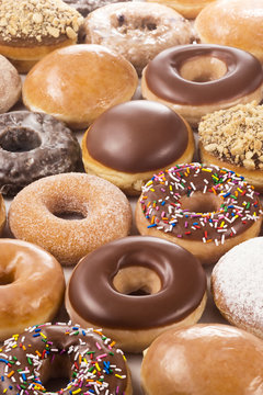 Background of Assorted Donuts (Doughnuts) of Various Flavors