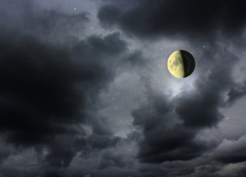 Moon glowing in the dark night sky