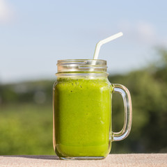 Smoothies from avocado, dill, celery and banana in glass