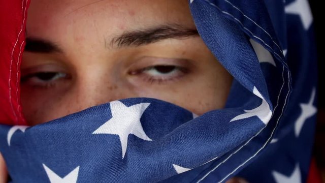 eyes close in american flag hijab