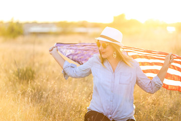 Patriotic mother and daughter with American flag