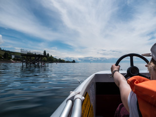 Girl steering a pedal boat on Lake Constance - 159779949