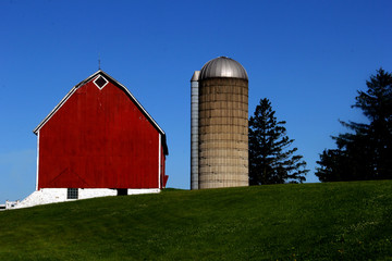 Old vintage red barn and silo