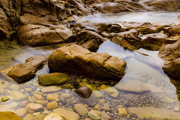 Colourful rocks and water at Diamond Head coast, Australia
