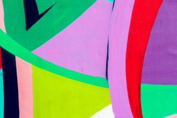 Bright wall with detail of a graffiti, street art. Abstract creative drawing fashion colors. Modern iconic urban culture street of youth, stylish picture for backdrop