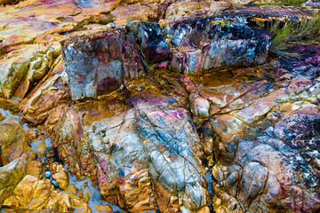 Colourful rocks at Diamond Head coast, Australia