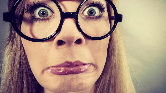 Closeup woman shocked face with eyeglasses
