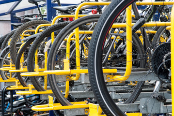 bikes lined up in the store in yellow rack