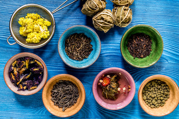 Drink herbal tea with brew blue wooden table background top view