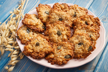 Fresh homemade oatmeal cookies and ears of oat, healthy dessert