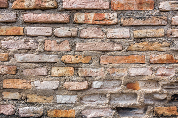 Brown brick wall in an old contemporary temple in Thailand