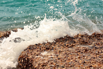 Obraz premium Blue sea waves with a lot of sea foam. Beautiful blue waves with a lot of sea foam scene looked from above, close up