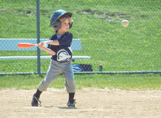 Child Playing Baseball © J. Novack