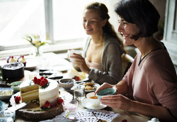 Friends Gathering Together on Tea Party Eating Cakes Enjoyment happiness - obrazy, fototapety, plakaty