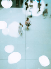 business people walking in shopping mall blur motion