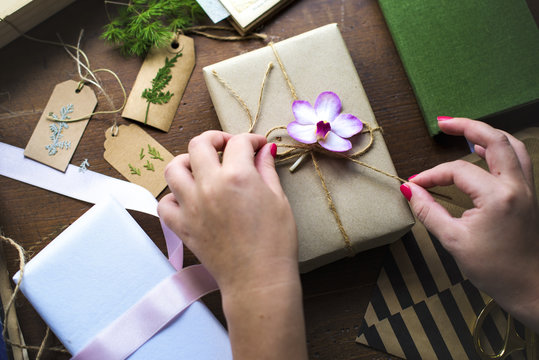 Hands Diy Wrapping Gift Box On Wooden Table