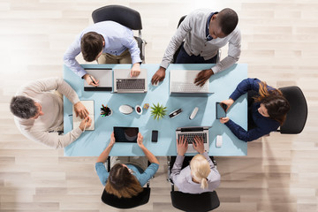 Group Of Businesspeople Working In Office