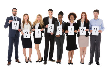 Obraz premium Businesspeople Holding Question Mark Sign