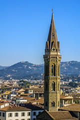 Fototapeta na wymiar Bell tower Badia Fiorentina in Florence, Italy