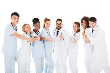 Group Of Medical Team Gesturing Thumbs Up