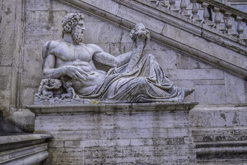 Fototapeta na wymiar Roman God Tiber, Fountain of Rome Triumphant, Roman Capital Square, Rome, Italy