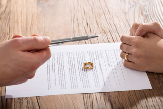 Couple Signing Divorce Paper