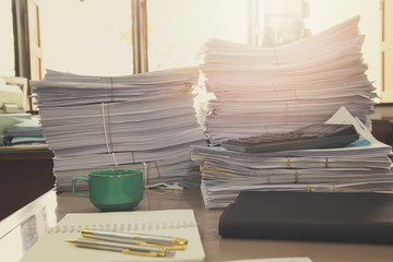 Pile of unfinished documents on office desk, Stack of business paper, Vintage Effect