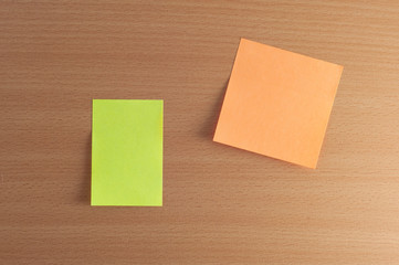 blank sticky notes on the wooden wall