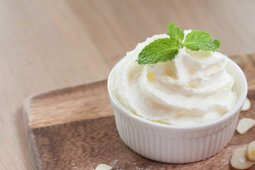 Whipped cream in ceramic cup 