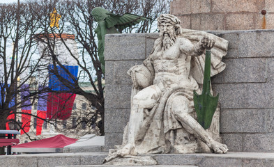Statue of Neptune on the rostral column in St. Petersburg, Russia