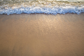 wave of  ocean on sandy beach.