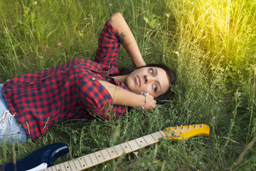 Girl with electric guitar.