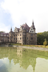 Fototapeta na wymiar 17th century Moszna Castle , pool, Upper Silesia, Poland