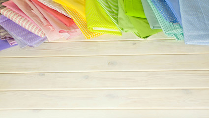 Accessories for sewing lie on a white background. Measuring tape, thread, fabric, needle bar and...