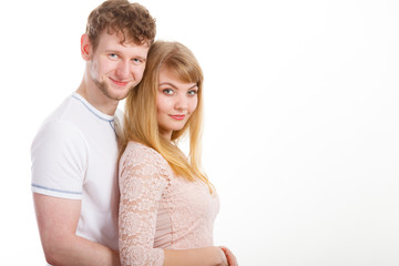 Happy enamoured couple hugging each other.