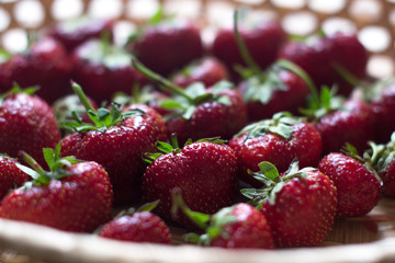 Fresh juicy strawberries on a wooden board.