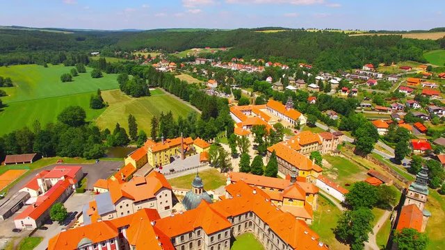 Camera flight over Cistercian monastery Plasy in Bohemia founded by a ruler &ndash; the prince Vladislav II. in 1144. European monuments from above. Czech Republic, Central Europe.