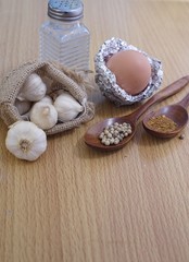 Raw pork, egg, pepper and garlic background