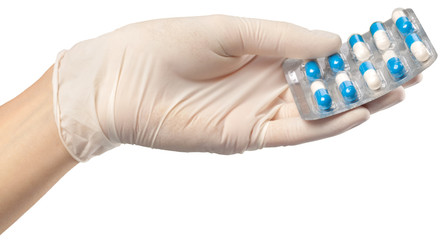 human hand holding  pills