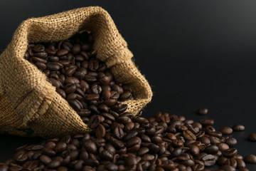 coffee beans in sack on black background