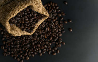 coffee beans in sack on black background