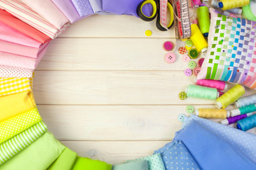 Cotton colored fabric. Background of white wood.