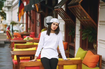 Fashion model on the street. Beautiful young woman in stylish summer clothes