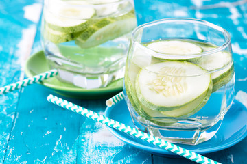 Cucumber water in glass on table