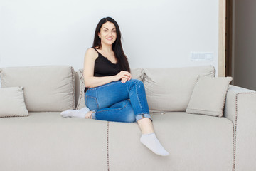 Obraz premium Portrait of beautiful brunette mature woman relaxing at home