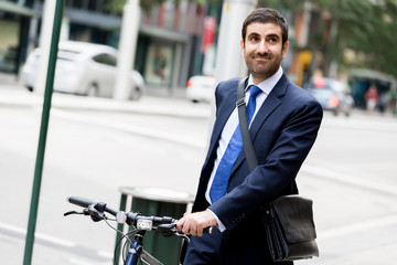 Young businessmen with a bike