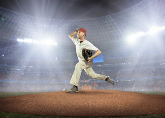 Fototapeta na wymiar Baseball players in action on the stadium.