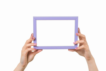 Frame in female hands on a white background