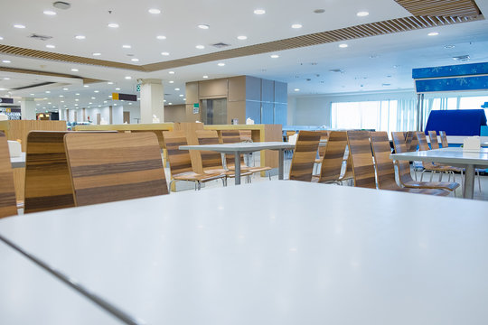 Interior Of White Table And Wooden Table On Food Court In Shopping Mall.